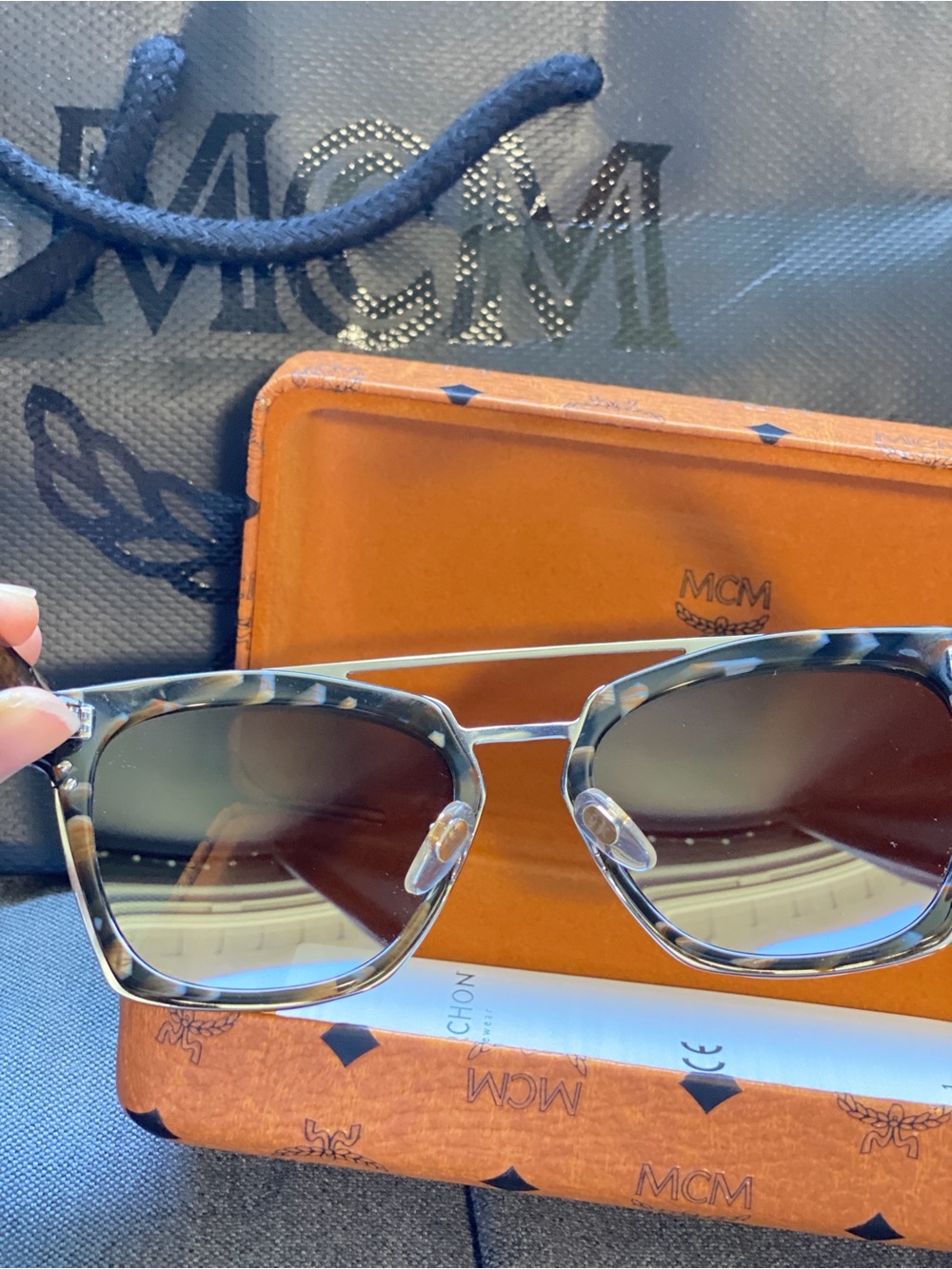 Sunglasses with MCM case